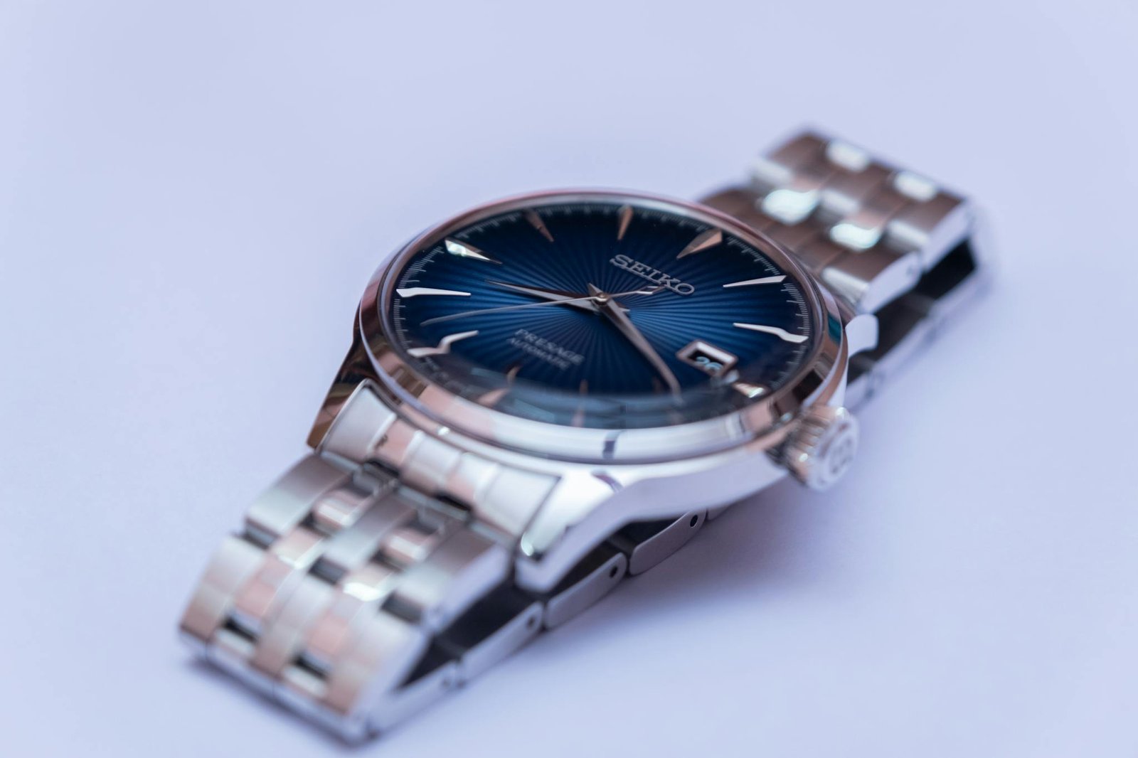 Detailed shot of a Seiko wristwatch with a metallic band, perfect for timepiece enthusiasts and accessory lovers.